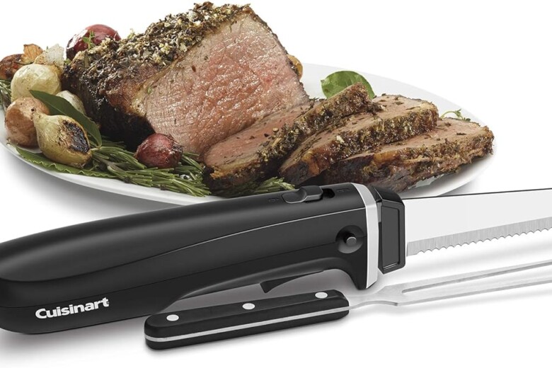 Cuisinart electric knife beside slices of roasted meat on a garnished plate