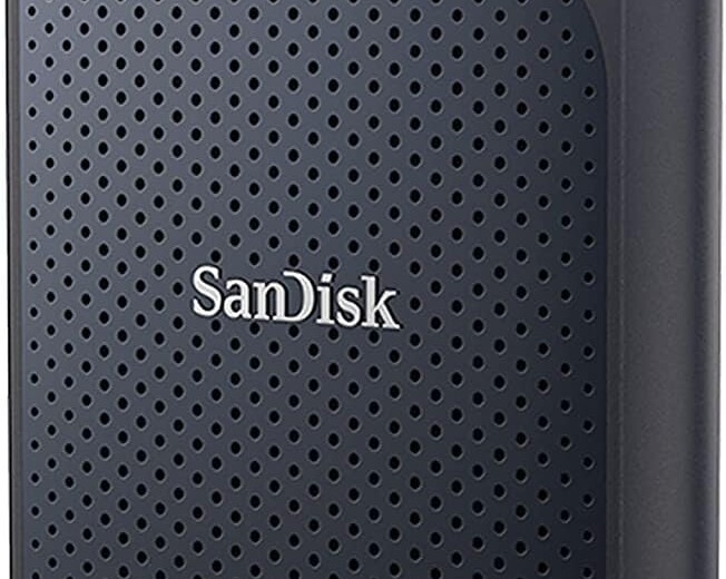 Portable external solid state drive (SSD) by SanDisk, with a black and orange design and textured surface.